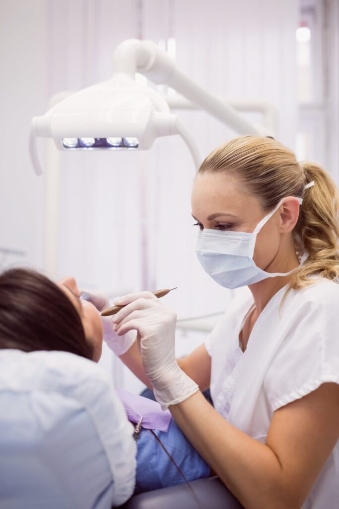 dentist-examining-female-patient-1